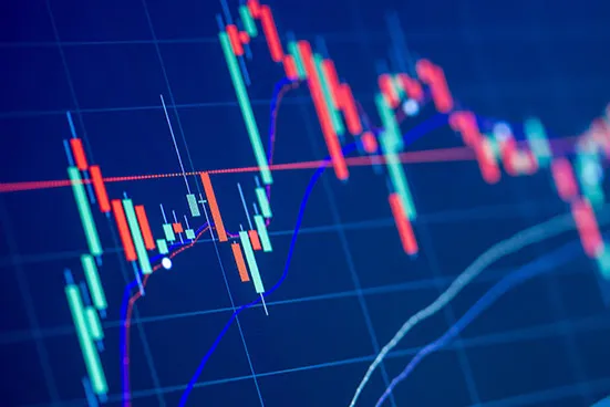 A stock market performance chart on a screen